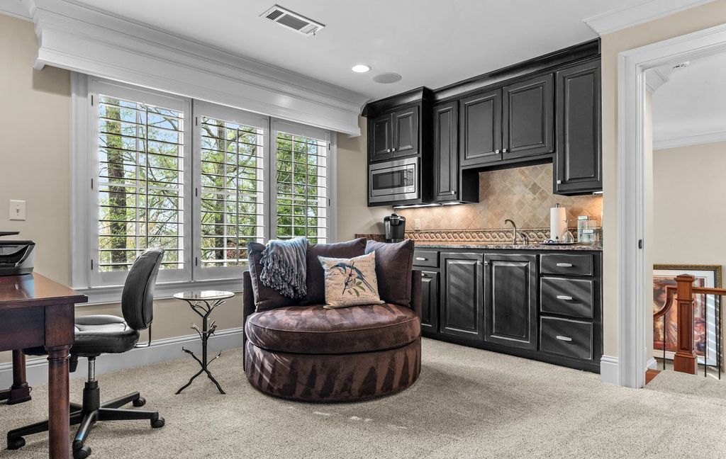 1461 North Shore Drive Home in Greensboro, Georgia. Discover unmatched luxury at this stunning family lake house near the Ritz and LakeClub. Enjoy expansive lake views, resort-style infinity pool, 4-car garage, spacious suites, two kitchens, and an elevator. 