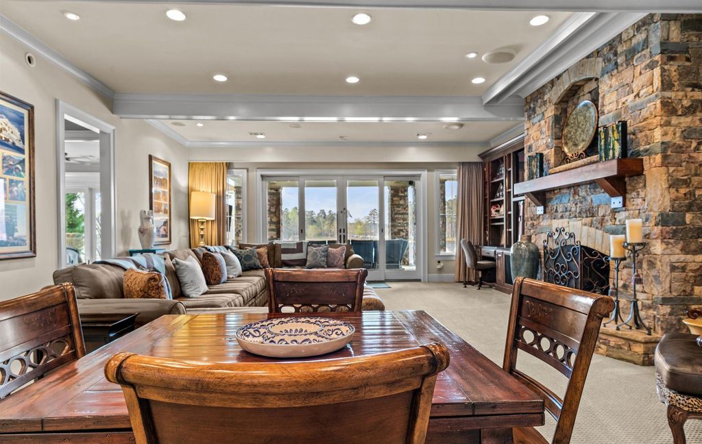 1461 North Shore Drive Home in Greensboro, Georgia. Discover unmatched luxury at this stunning family lake house near the Ritz and LakeClub. Enjoy expansive lake views, resort-style infinity pool, 4-car garage, spacious suites, two kitchens, and an elevator. 