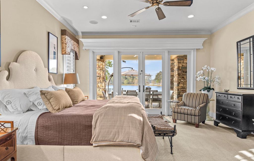 1461 North Shore Drive Home in Greensboro, Georgia. Discover unmatched luxury at this stunning family lake house near the Ritz and LakeClub. Enjoy expansive lake views, resort-style infinity pool, 4-car garage, spacious suites, two kitchens, and an elevator. 