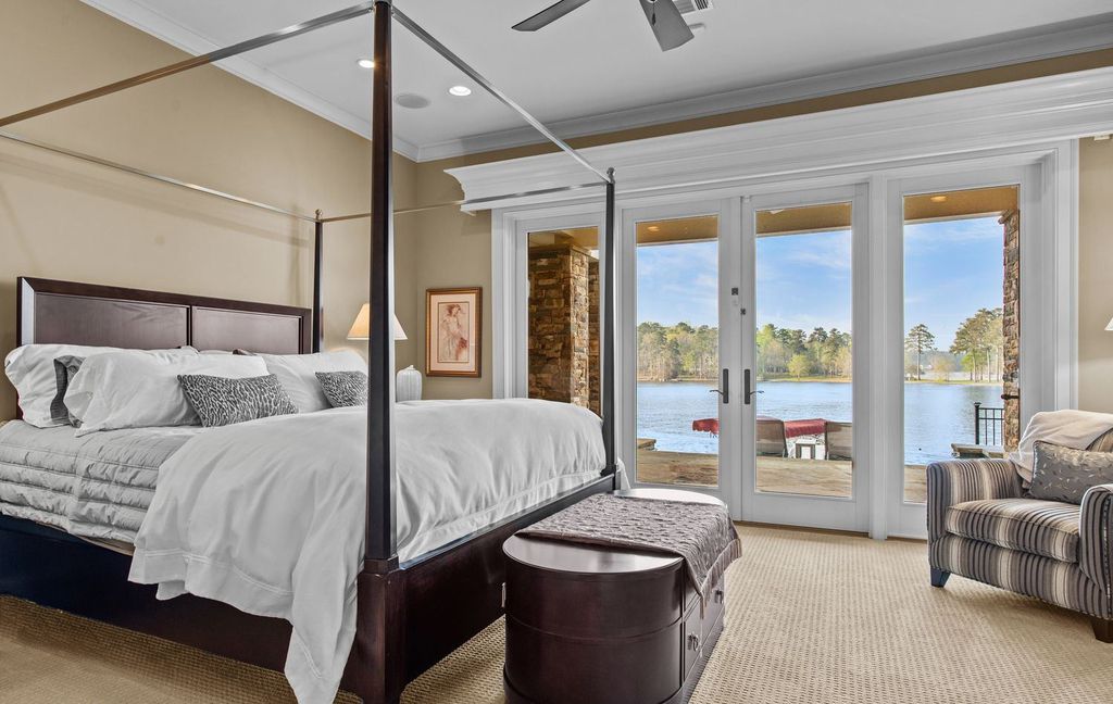 1461 North Shore Drive Home in Greensboro, Georgia. Discover unmatched luxury at this stunning family lake house near the Ritz and LakeClub. Enjoy expansive lake views, resort-style infinity pool, 4-car garage, spacious suites, two kitchens, and an elevator. 