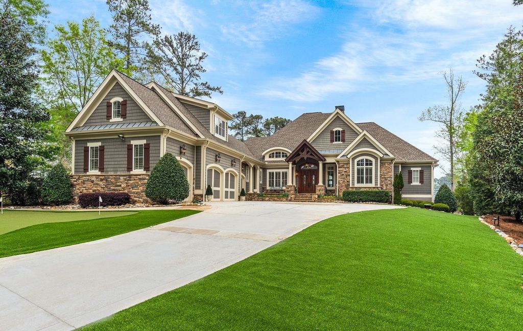 1461 North Shore Drive Home in Greensboro, Georgia. Discover unmatched luxury at this stunning family lake house near the Ritz and LakeClub. Enjoy expansive lake views, resort-style infinity pool, 4-car garage, spacious suites, two kitchens, and an elevator. 