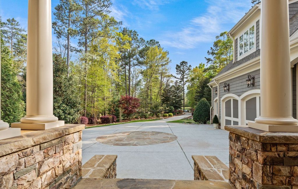 1461 North Shore Drive Home in Greensboro, Georgia. Discover unmatched luxury at this stunning family lake house near the Ritz and LakeClub. Enjoy expansive lake views, resort-style infinity pool, 4-car garage, spacious suites, two kitchens, and an elevator. 