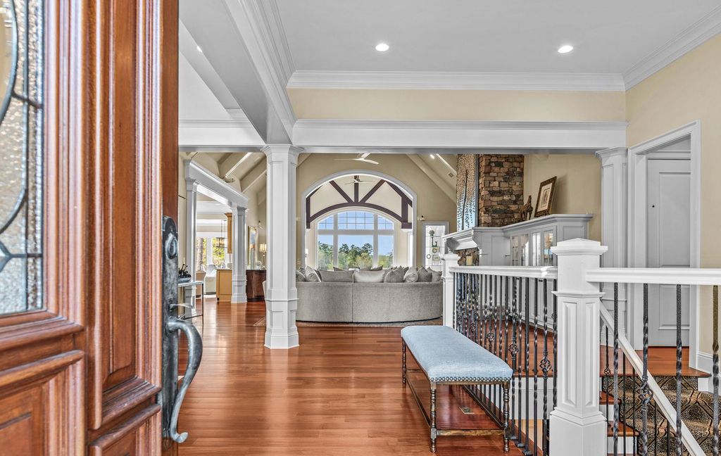 1461 North Shore Drive Home in Greensboro, Georgia. Discover unmatched luxury at this stunning family lake house near the Ritz and LakeClub. Enjoy expansive lake views, resort-style infinity pool, 4-car garage, spacious suites, two kitchens, and an elevator. 