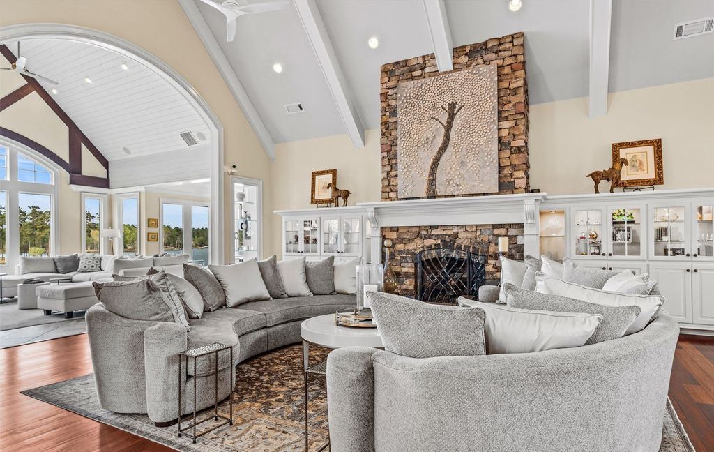 1461 North Shore Drive Home in Greensboro, Georgia. Discover unmatched luxury at this stunning family lake house near the Ritz and LakeClub. Enjoy expansive lake views, resort-style infinity pool, 4-car garage, spacious suites, two kitchens, and an elevator. 