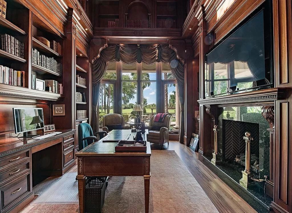 Discover unparalleled luxury living in the prestigious Estates at Bay Colony with this exquisite European-inspired residence nestled on a double lakefront estate.