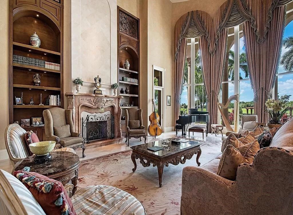 Discover unparalleled luxury living in the prestigious Estates at Bay Colony with this exquisite European-inspired residence nestled on a double lakefront estate.