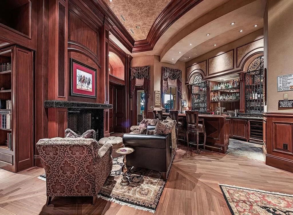 Discover unparalleled luxury living in the prestigious Estates at Bay Colony with this exquisite European-inspired residence nestled on a double lakefront estate.
