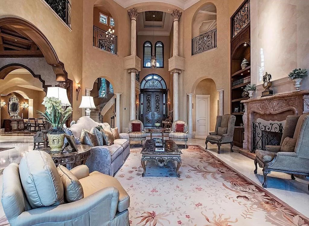 Discover unparalleled luxury living in the prestigious Estates at Bay Colony with this exquisite European-inspired residence nestled on a double lakefront estate.