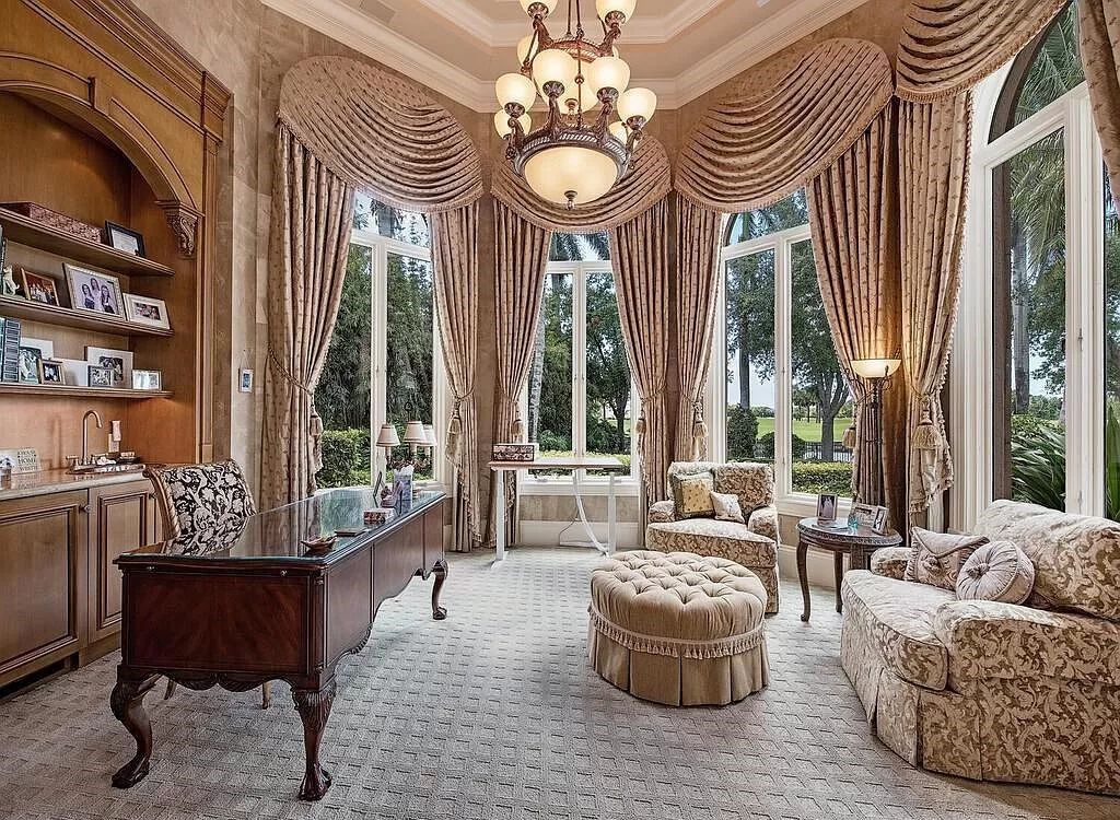 Discover unparalleled luxury living in the prestigious Estates at Bay Colony with this exquisite European-inspired residence nestled on a double lakefront estate.