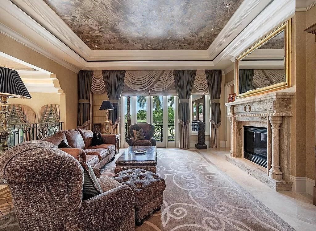 Discover unparalleled luxury living in the prestigious Estates at Bay Colony with this exquisite European-inspired residence nestled on a double lakefront estate.
