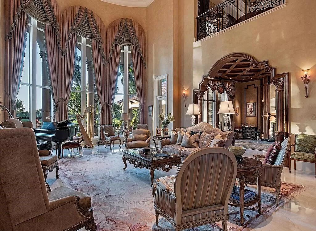 Discover unparalleled luxury living in the prestigious Estates at Bay Colony with this exquisite European-inspired residence nestled on a double lakefront estate.