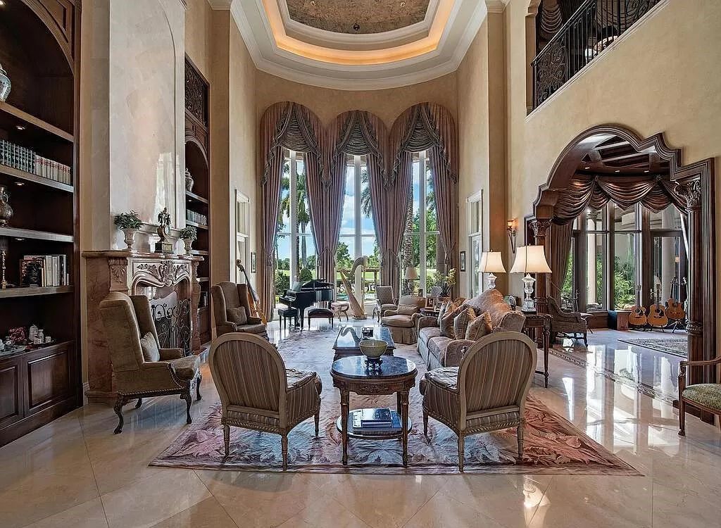 Discover unparalleled luxury living in the prestigious Estates at Bay Colony with this exquisite European-inspired residence nestled on a double lakefront estate.