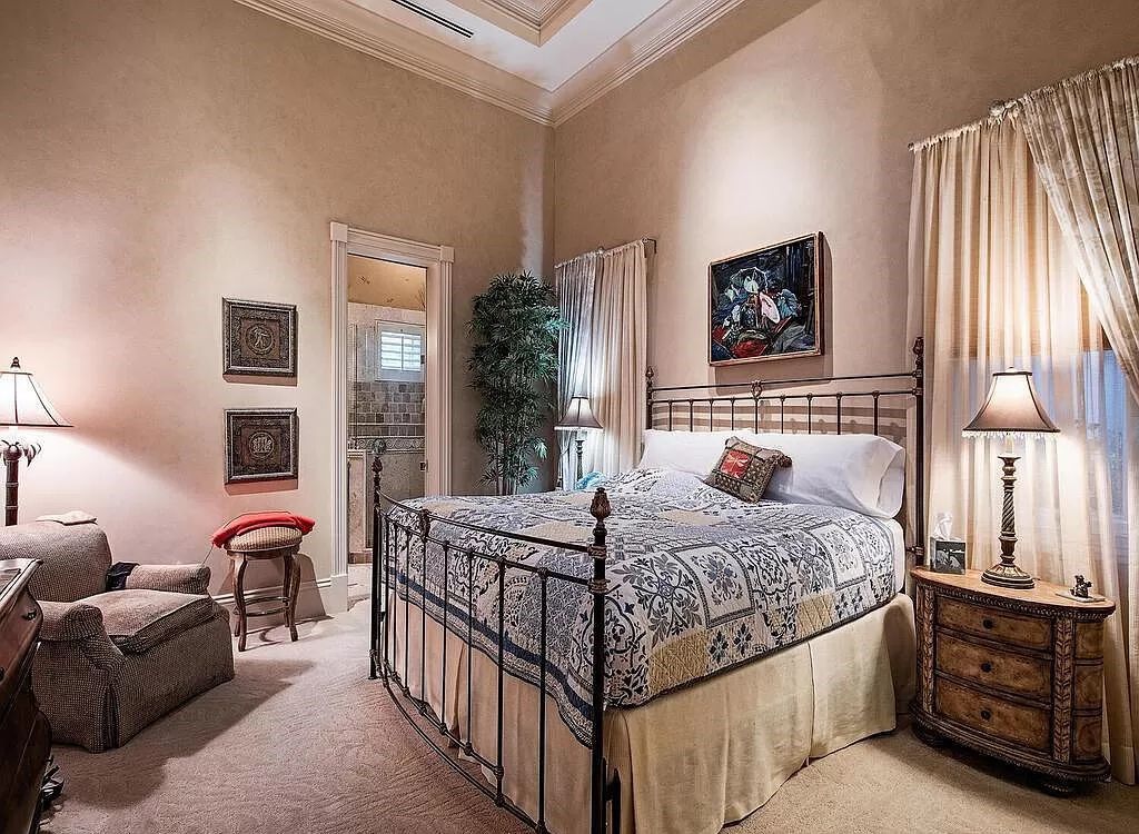 Discover unparalleled luxury living in the prestigious Estates at Bay Colony with this exquisite European-inspired residence nestled on a double lakefront estate.