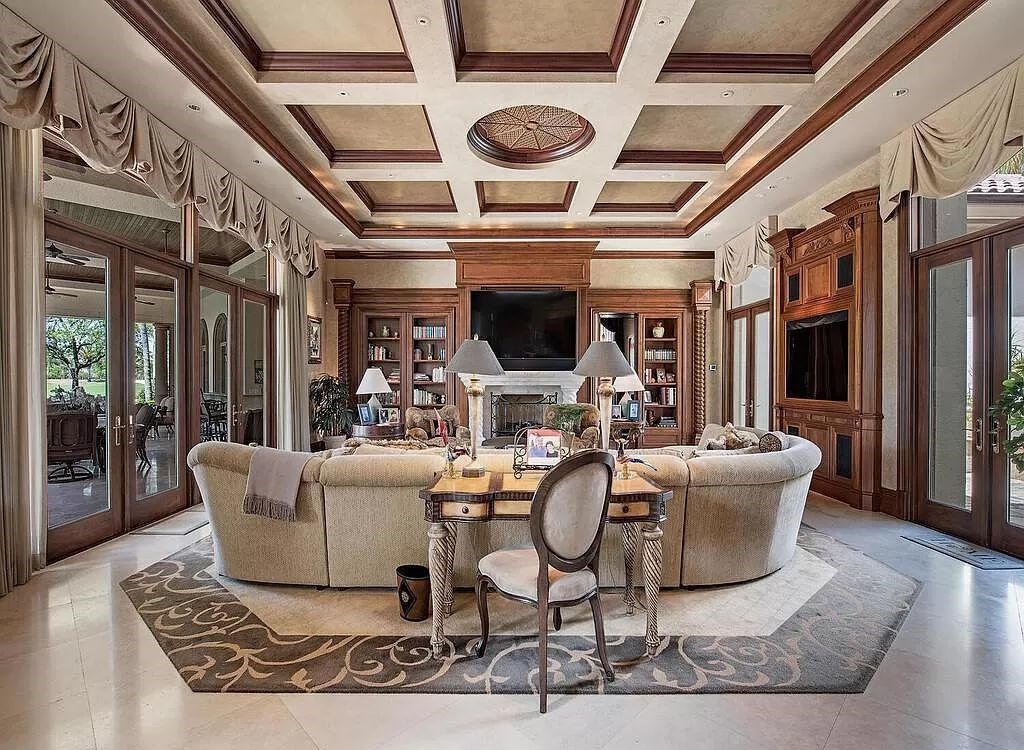 Discover unparalleled luxury living in the prestigious Estates at Bay Colony with this exquisite European-inspired residence nestled on a double lakefront estate.