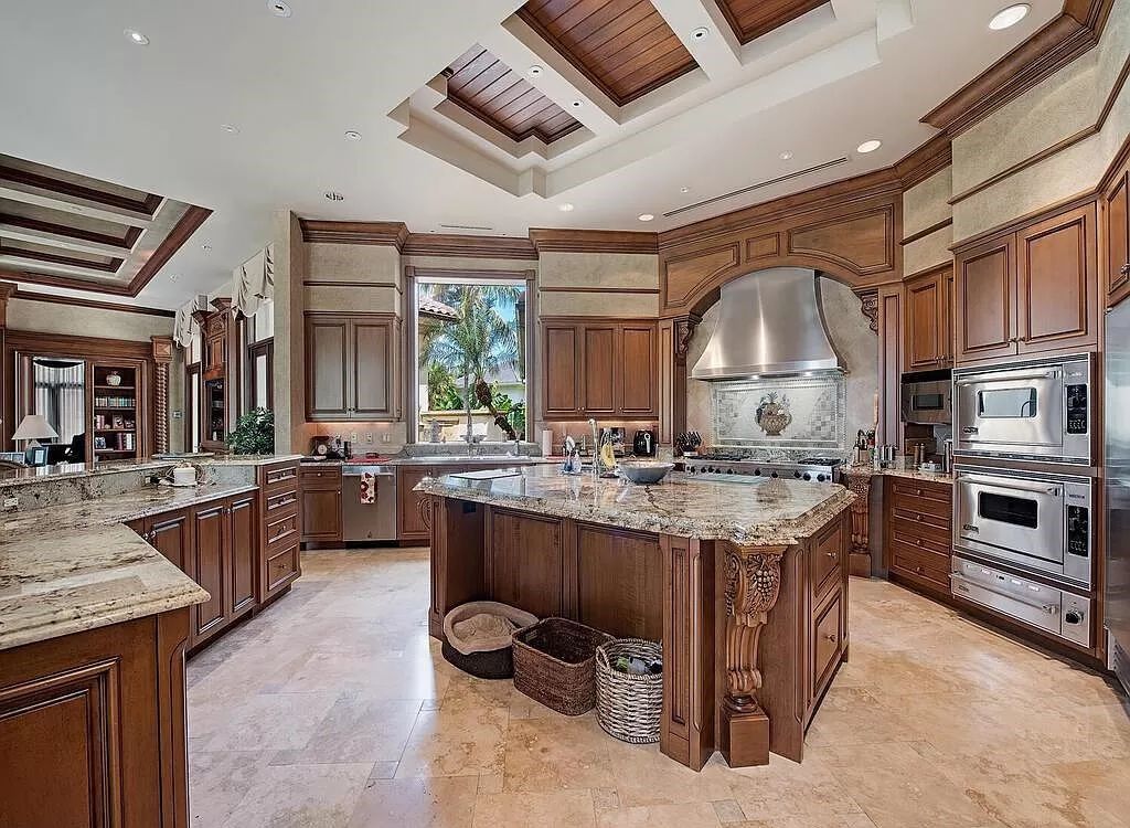 Discover unparalleled luxury living in the prestigious Estates at Bay Colony with this exquisite European-inspired residence nestled on a double lakefront estate.