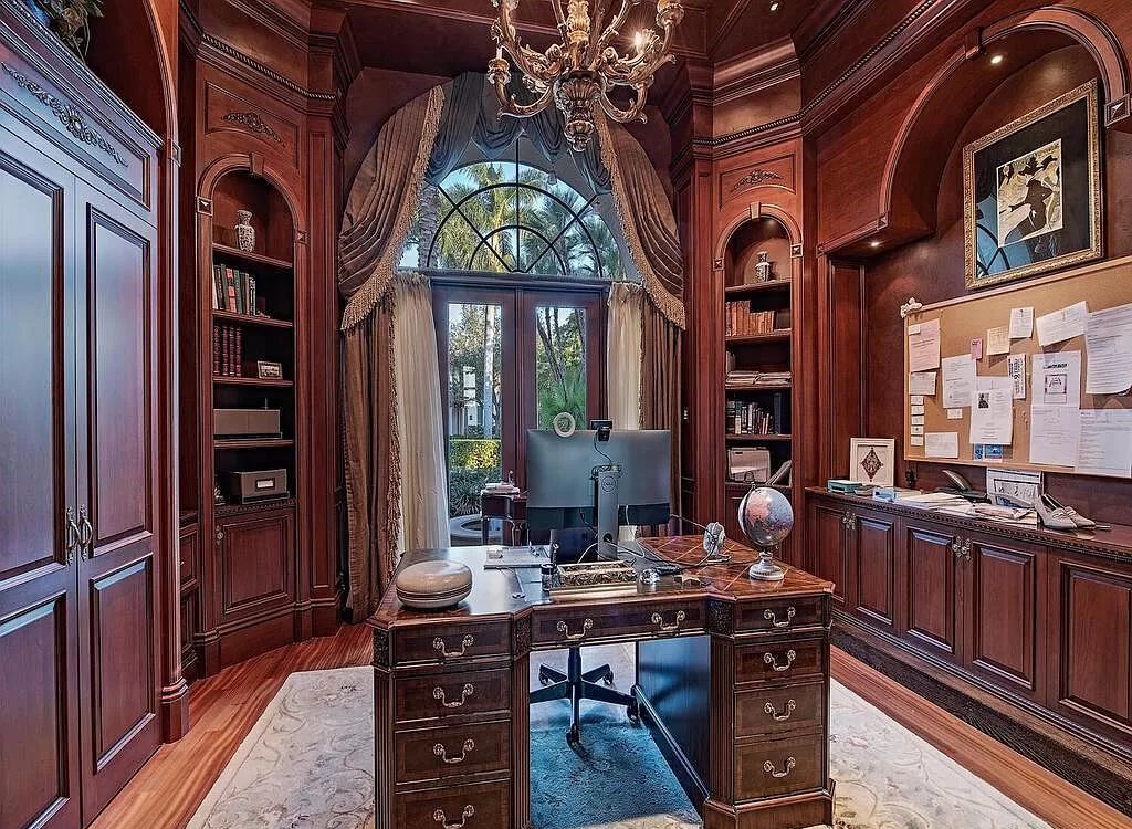 Discover unparalleled luxury living in the prestigious Estates at Bay Colony with this exquisite European-inspired residence nestled on a double lakefront estate.