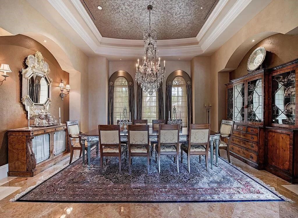 Discover unparalleled luxury living in the prestigious Estates at Bay Colony with this exquisite European-inspired residence nestled on a double lakefront estate.