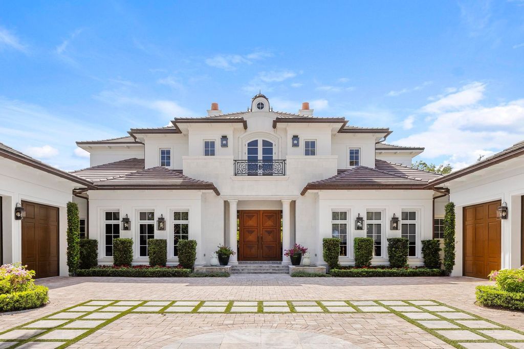 Welcome to 131 W Bears Club Drive, an exclusive retreat in Jupiter's prestigious golf community. This custom-built estate, one of only 48 in the enclave, offers over 12,000 square feet of luxury living on nearly 0.6 acres.
