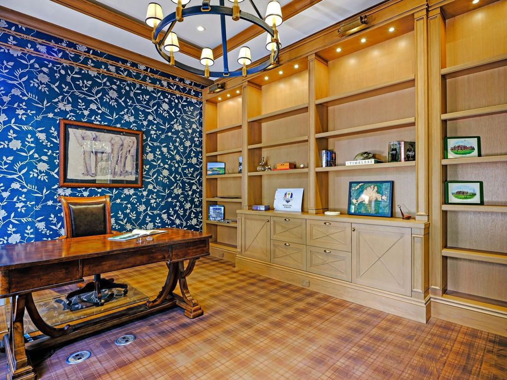 Welcome to 131 W Bears Club Drive, an exclusive retreat in Jupiter's prestigious golf community. This custom-built estate, one of only 48 in the enclave, offers over 12,000 square feet of luxury living on nearly 0.6 acres.
