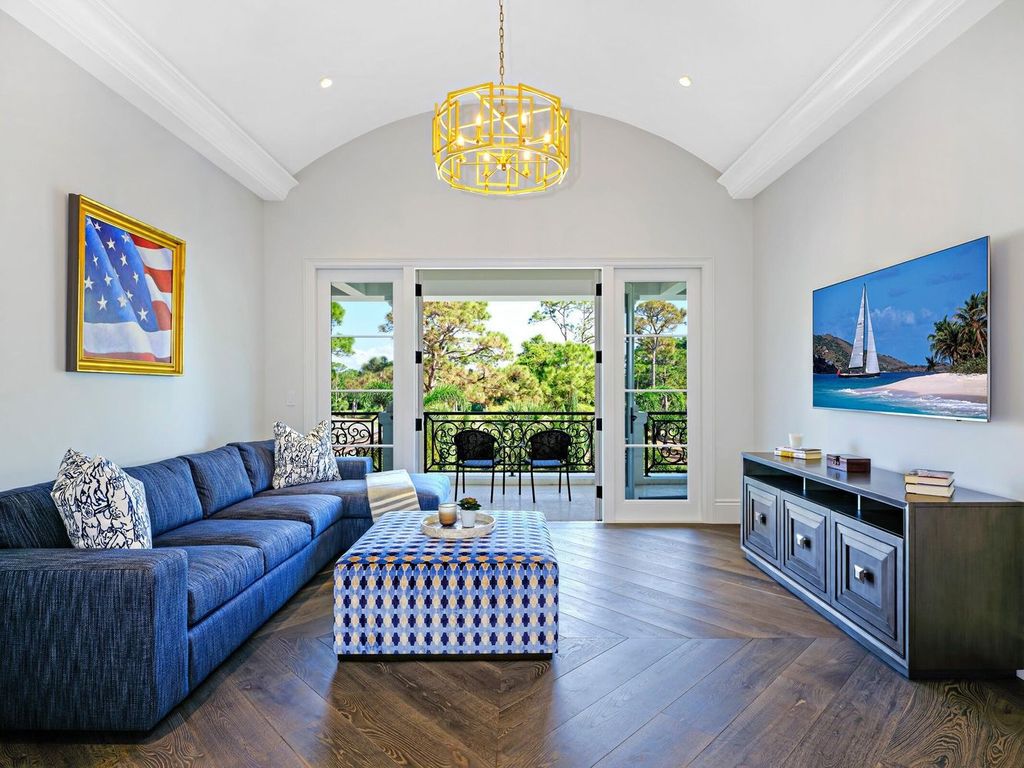 Welcome to 131 W Bears Club Drive, an exclusive retreat in Jupiter's prestigious golf community. This custom-built estate, one of only 48 in the enclave, offers over 12,000 square feet of luxury living on nearly 0.6 acres.