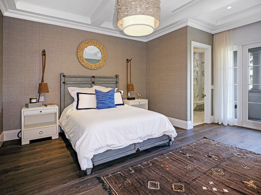 Welcome to 131 W Bears Club Drive, an exclusive retreat in Jupiter's prestigious golf community. This custom-built estate, one of only 48 in the enclave, offers over 12,000 square feet of luxury living on nearly 0.6 acres.
