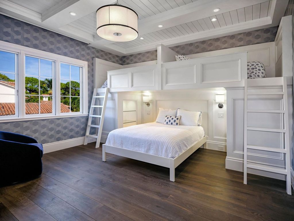 Welcome to 131 W Bears Club Drive, an exclusive retreat in Jupiter's prestigious golf community. This custom-built estate, one of only 48 in the enclave, offers over 12,000 square feet of luxury living on nearly 0.6 acres.