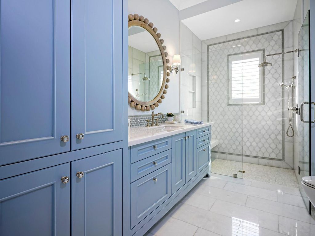 Welcome to 131 W Bears Club Drive, an exclusive retreat in Jupiter's prestigious golf community. This custom-built estate, one of only 48 in the enclave, offers over 12,000 square feet of luxury living on nearly 0.6 acres.