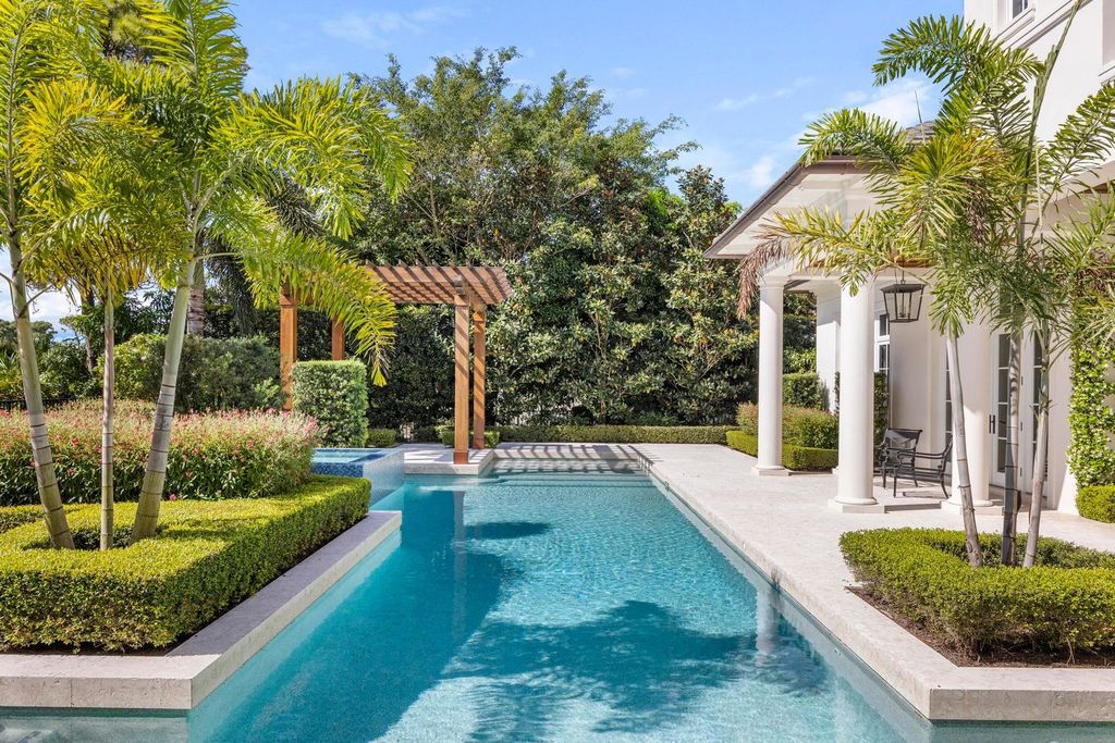 Welcome to 131 W Bears Club Drive, an exclusive retreat in Jupiter's prestigious golf community. This custom-built estate, one of only 48 in the enclave, offers over 12,000 square feet of luxury living on nearly 0.6 acres.