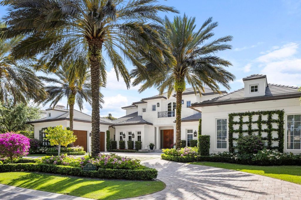 Welcome to 131 W Bears Club Drive, an exclusive retreat in Jupiter's prestigious golf community. This custom-built estate, one of only 48 in the enclave, offers over 12,000 square feet of luxury living on nearly 0.6 acres.