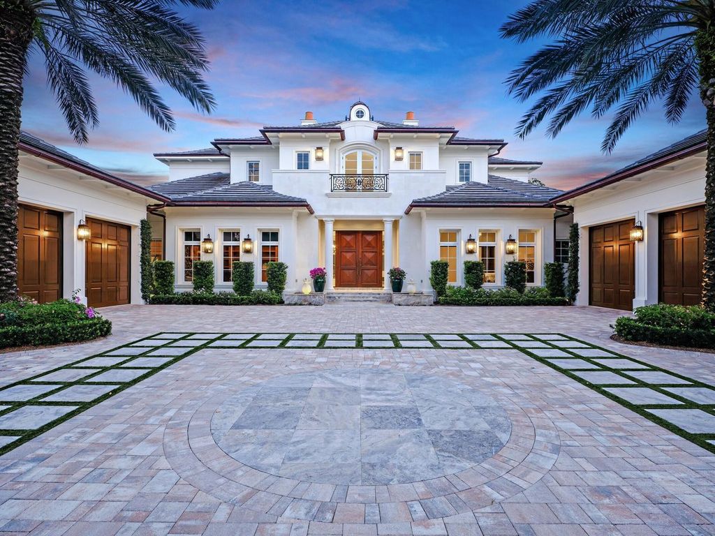 Welcome to 131 W Bears Club Drive, an exclusive retreat in Jupiter's prestigious golf community. This custom-built estate, one of only 48 in the enclave, offers over 12,000 square feet of luxury living on nearly 0.6 acres.