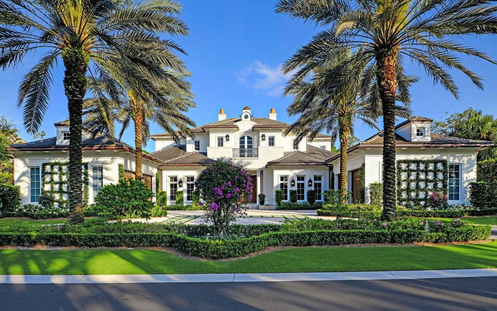 Welcome to 131 W Bears Club Drive, an exclusive retreat in Jupiter's prestigious golf community. This custom-built estate, one of only 48 in the enclave, offers over 12,000 square feet of luxury living on nearly 0.6 acres.