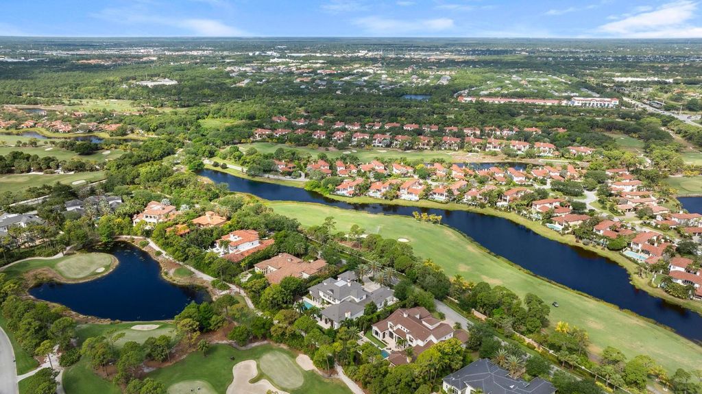 Welcome to 131 W Bears Club Drive, an exclusive retreat in Jupiter's prestigious golf community. This custom-built estate, one of only 48 in the enclave, offers over 12,000 square feet of luxury living on nearly 0.6 acres.