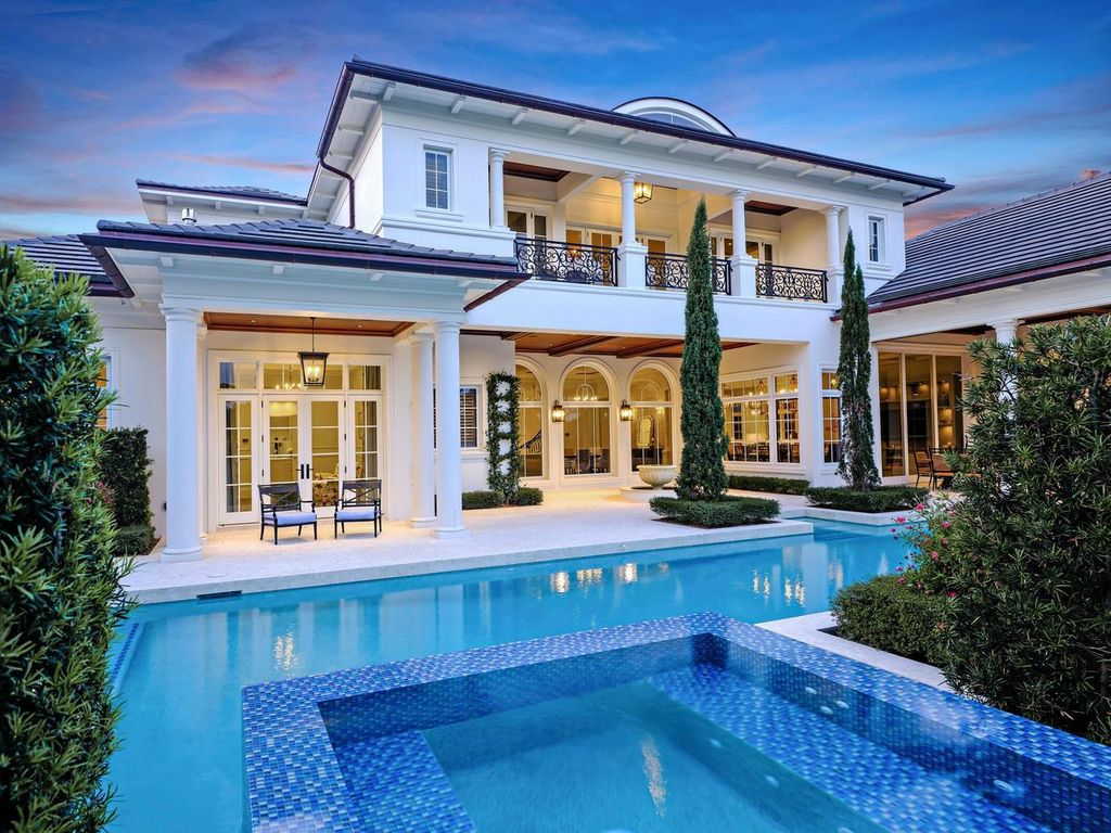 Welcome to 131 W Bears Club Drive, an exclusive retreat in Jupiter's prestigious golf community. This custom-built estate, one of only 48 in the enclave, offers over 12,000 square feet of luxury living on nearly 0.6 acres.