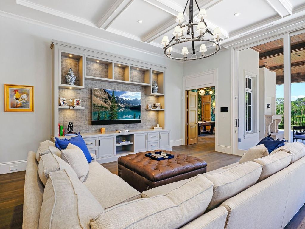 Welcome to 131 W Bears Club Drive, an exclusive retreat in Jupiter's prestigious golf community. This custom-built estate, one of only 48 in the enclave, offers over 12,000 square feet of luxury living on nearly 0.6 acres.