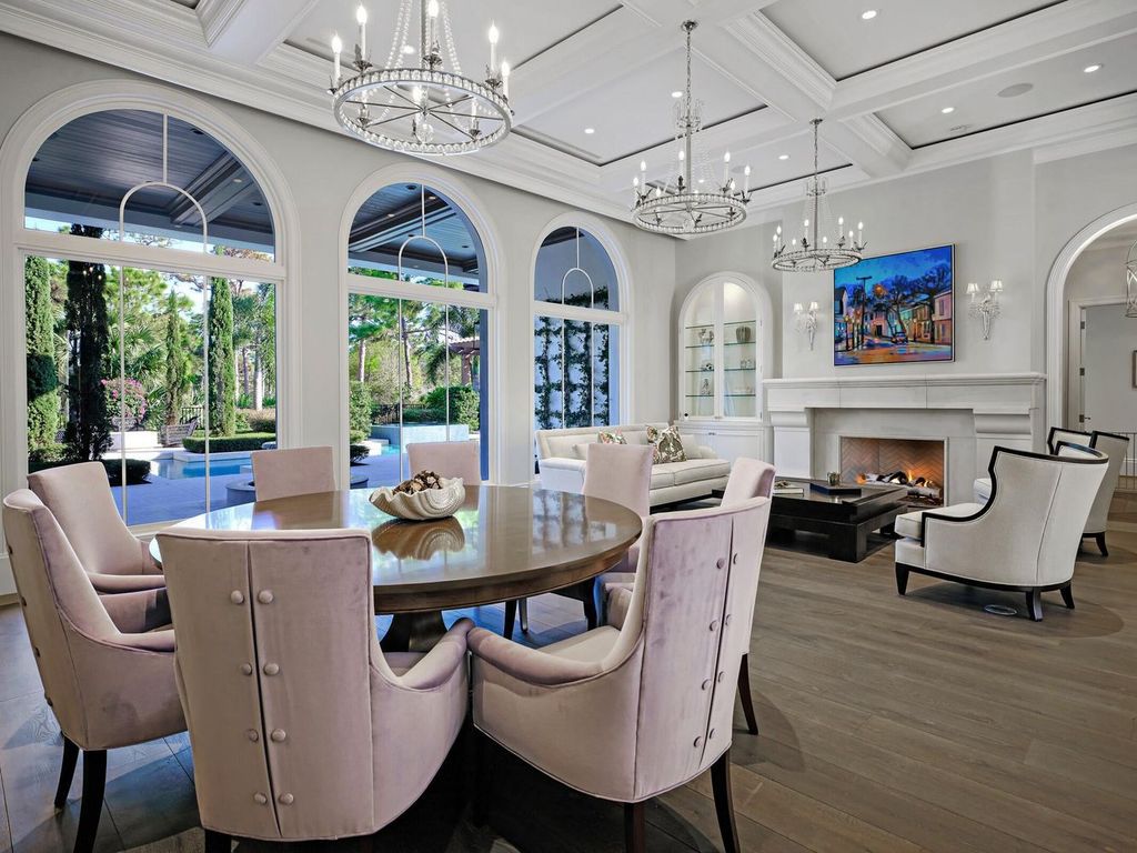 Welcome to 131 W Bears Club Drive, an exclusive retreat in Jupiter's prestigious golf community. This custom-built estate, one of only 48 in the enclave, offers over 12,000 square feet of luxury living on nearly 0.6 acres.