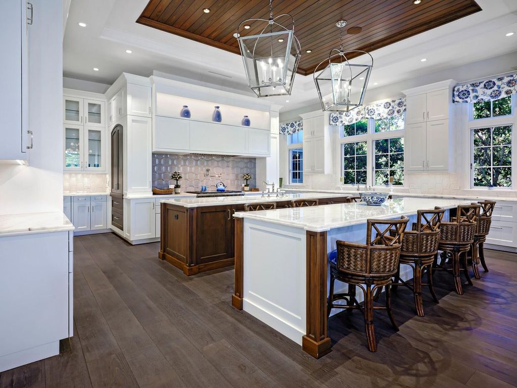 Welcome to 131 W Bears Club Drive, an exclusive retreat in Jupiter's prestigious golf community. This custom-built estate, one of only 48 in the enclave, offers over 12,000 square feet of luxury living on nearly 0.6 acres.