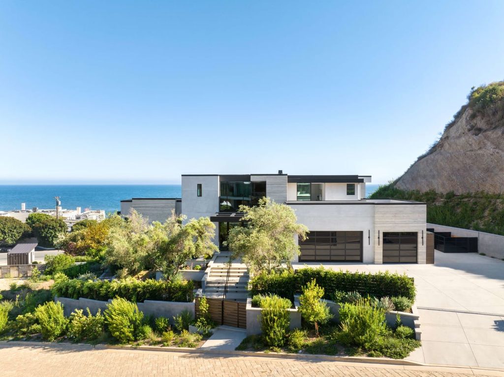 23917 Malibu Road Home in Malibu, California. Experience luxury coastal living in this contemporary masterpiece by architect Doug Burdge, located in the private and gated Malibu Colony Estates.