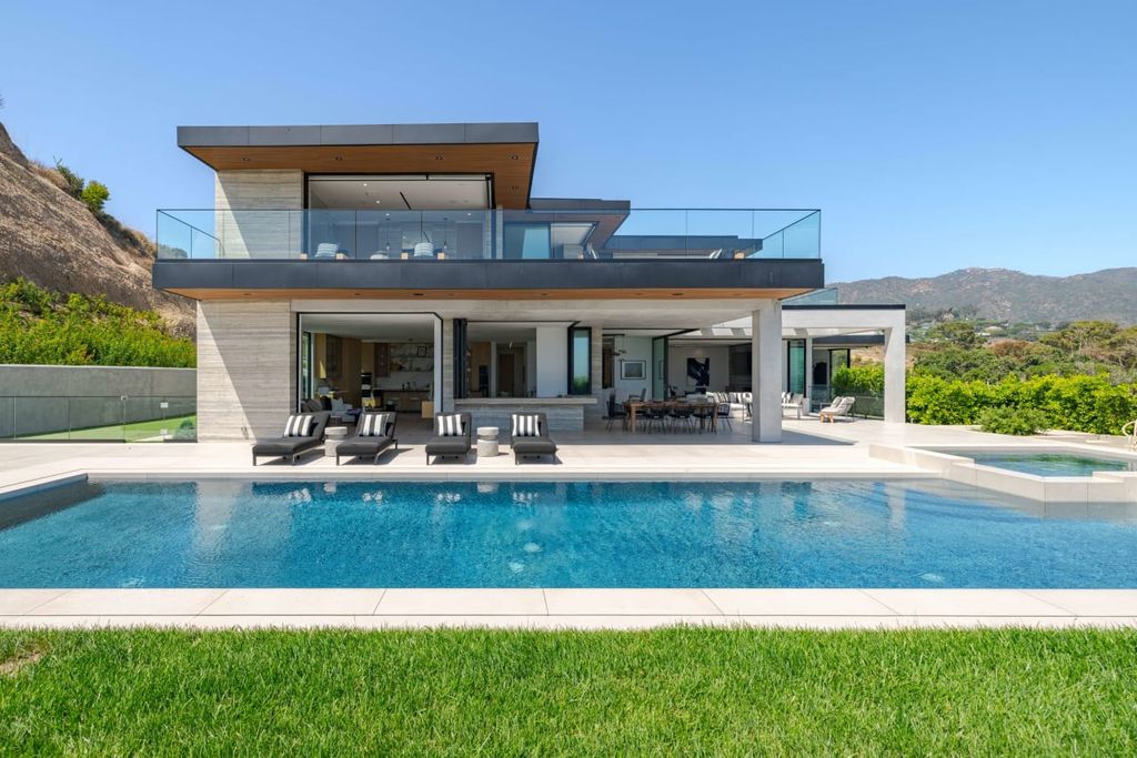 23917 Malibu Road Home in Malibu, California. Experience luxury coastal living in this contemporary masterpiece by architect Doug Burdge, located in the private and gated Malibu Colony Estates.