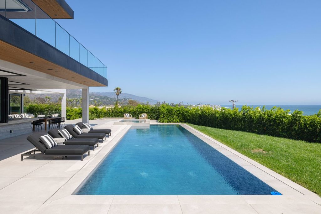 23917 Malibu Road Home in Malibu, California. Experience luxury coastal living in this contemporary masterpiece by architect Doug Burdge, located in the private and gated Malibu Colony Estates.