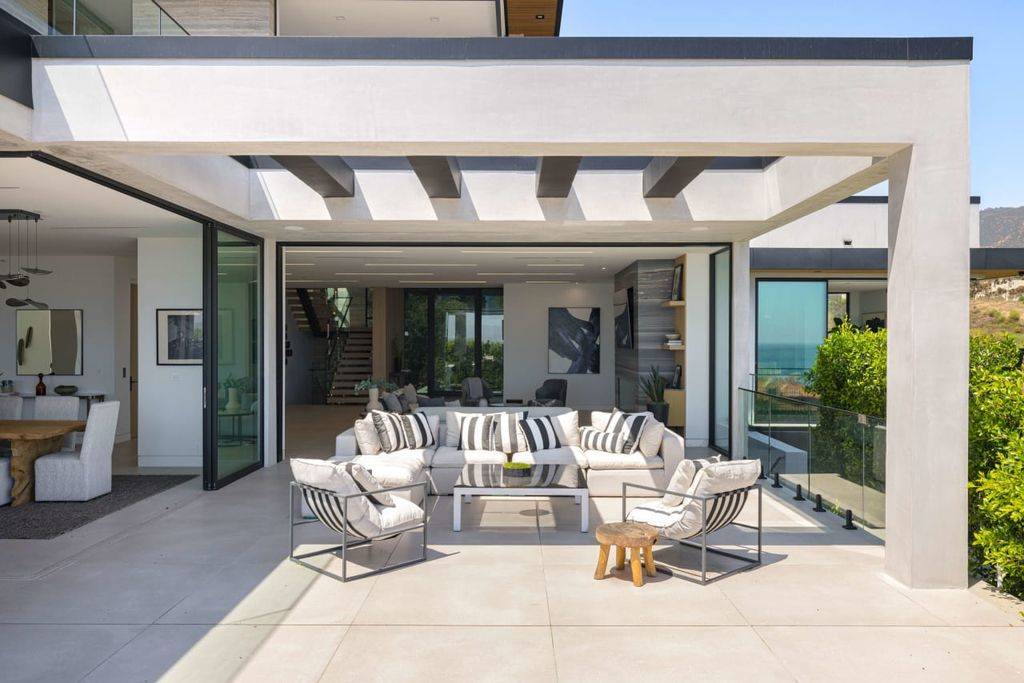 23917 Malibu Road Home in Malibu, California. Experience luxury coastal living in this contemporary masterpiece by architect Doug Burdge, located in the private and gated Malibu Colony Estates.