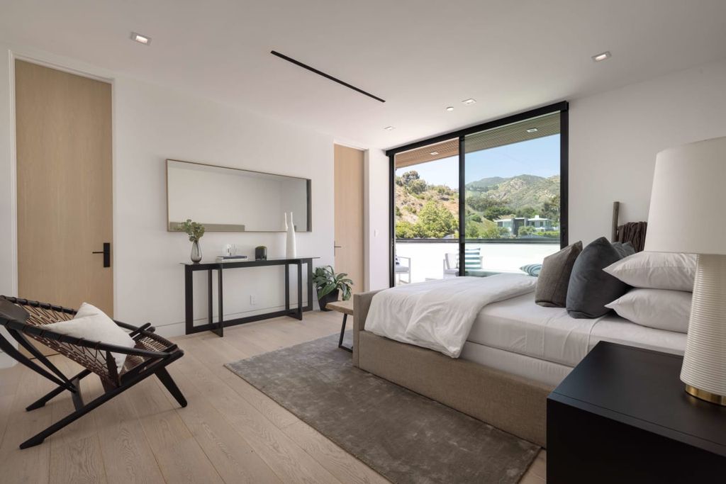 23917 Malibu Road Home in Malibu, California. Experience luxury coastal living in this contemporary masterpiece by architect Doug Burdge, located in the private and gated Malibu Colony Estates.