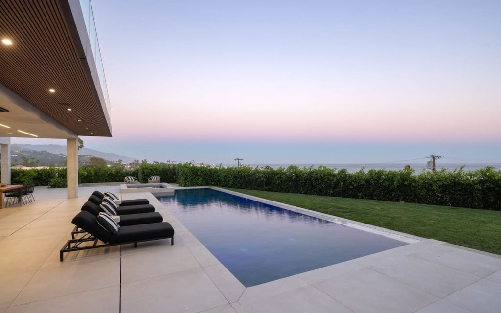 23917 Malibu Road Home in Malibu, California. Experience luxury coastal living in this contemporary masterpiece by architect Doug Burdge, located in the private and gated Malibu Colony Estates.