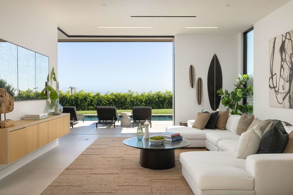 23917 Malibu Road Home in Malibu, California. Experience luxury coastal living in this contemporary masterpiece by architect Doug Burdge, located in the private and gated Malibu Colony Estates.