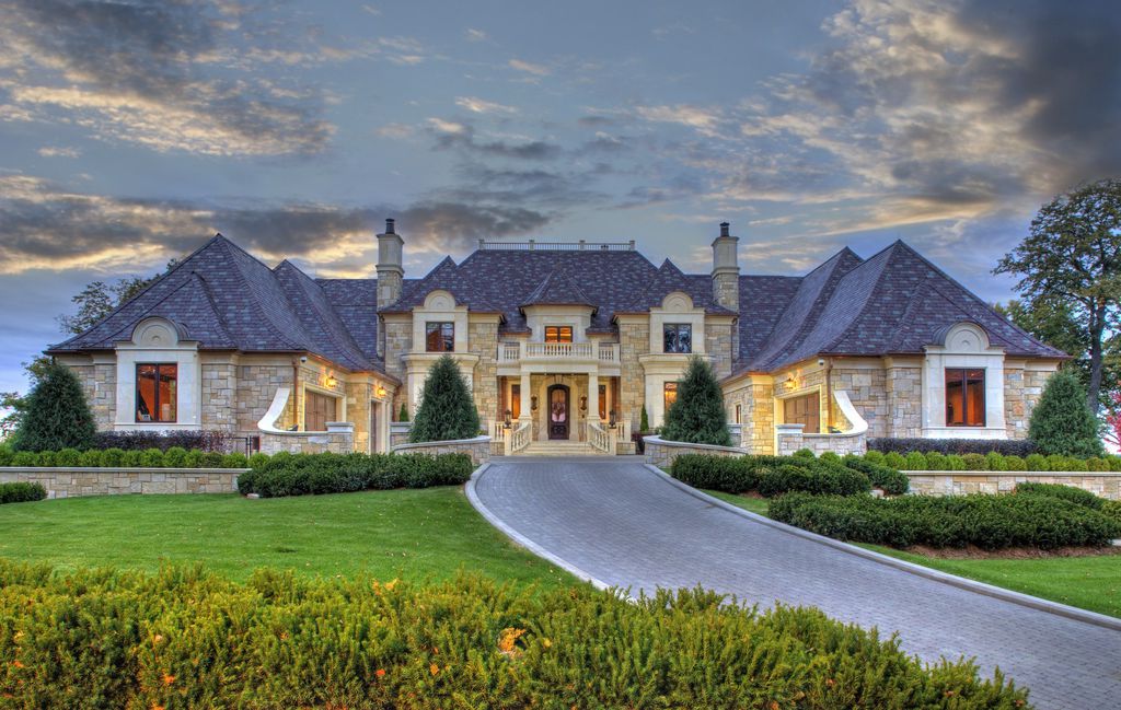 3770 Northome Road Home in Wayzata, Minnesota. Discover the epitome of luxury living on Lake Minnetonka with this John Kraemer & Sons masterpiece. From the luxurious master suite to the state-of-the-art amenities including a bowling alley, golf simulator, and Cavern Music Club, no detail has been overlooked. 