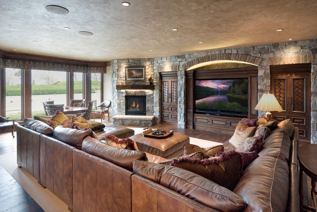 3770 Northome Road Home in Wayzata, Minnesota. Discover the epitome of luxury living on Lake Minnetonka with this John Kraemer & Sons masterpiece. From the luxurious master suite to the state-of-the-art amenities including a bowling alley, golf simulator, and Cavern Music Club, no detail has been overlooked. 