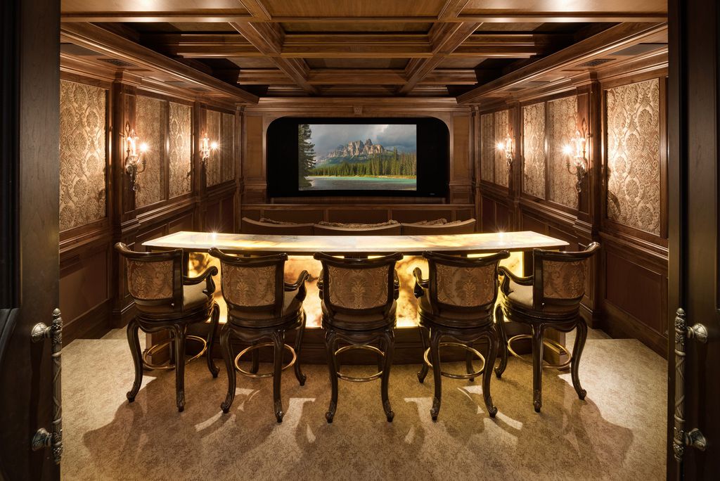 3770 Northome Road Home in Wayzata, Minnesota. Discover the epitome of luxury living on Lake Minnetonka with this John Kraemer & Sons masterpiece. From the luxurious master suite to the state-of-the-art amenities including a bowling alley, golf simulator, and Cavern Music Club, no detail has been overlooked. 
