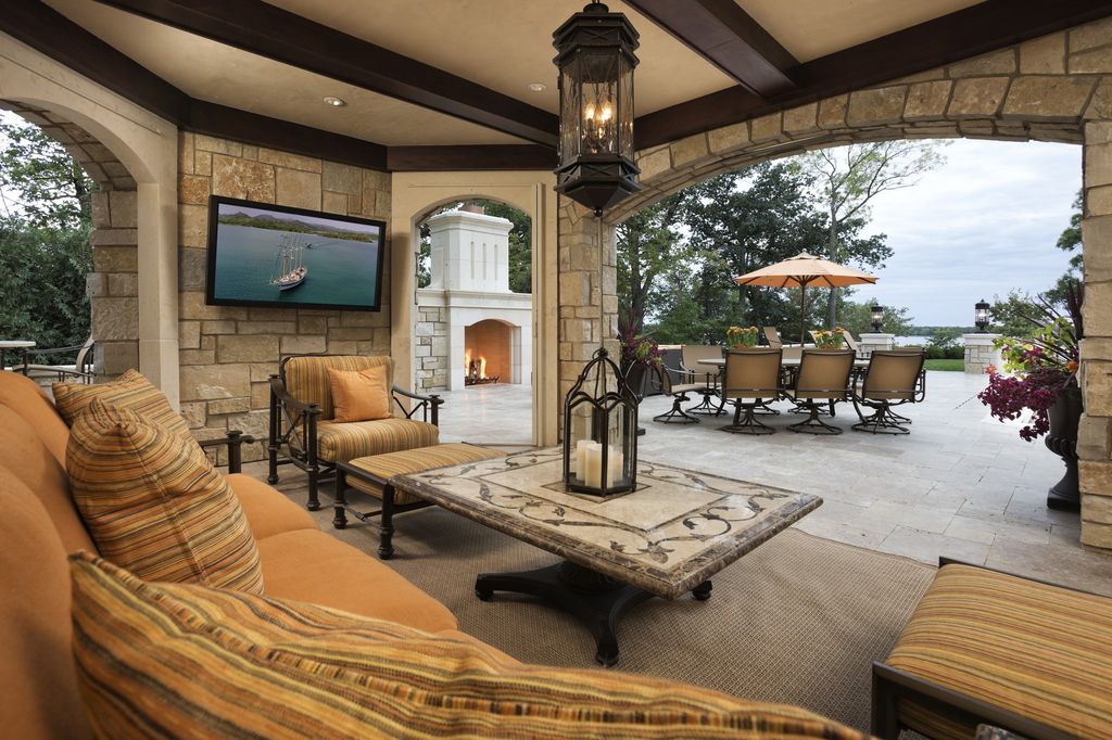 3770 Northome Road Home in Wayzata, Minnesota. Discover the epitome of luxury living on Lake Minnetonka with this John Kraemer & Sons masterpiece. From the luxurious master suite to the state-of-the-art amenities including a bowling alley, golf simulator, and Cavern Music Club, no detail has been overlooked. 