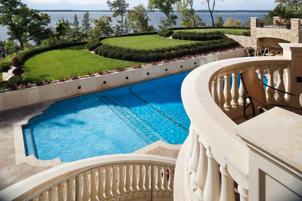 3770 Northome Road Home in Wayzata, Minnesota. Discover the epitome of luxury living on Lake Minnetonka with this John Kraemer & Sons masterpiece. From the luxurious master suite to the state-of-the-art amenities including a bowling alley, golf simulator, and Cavern Music Club, no detail has been overlooked. 