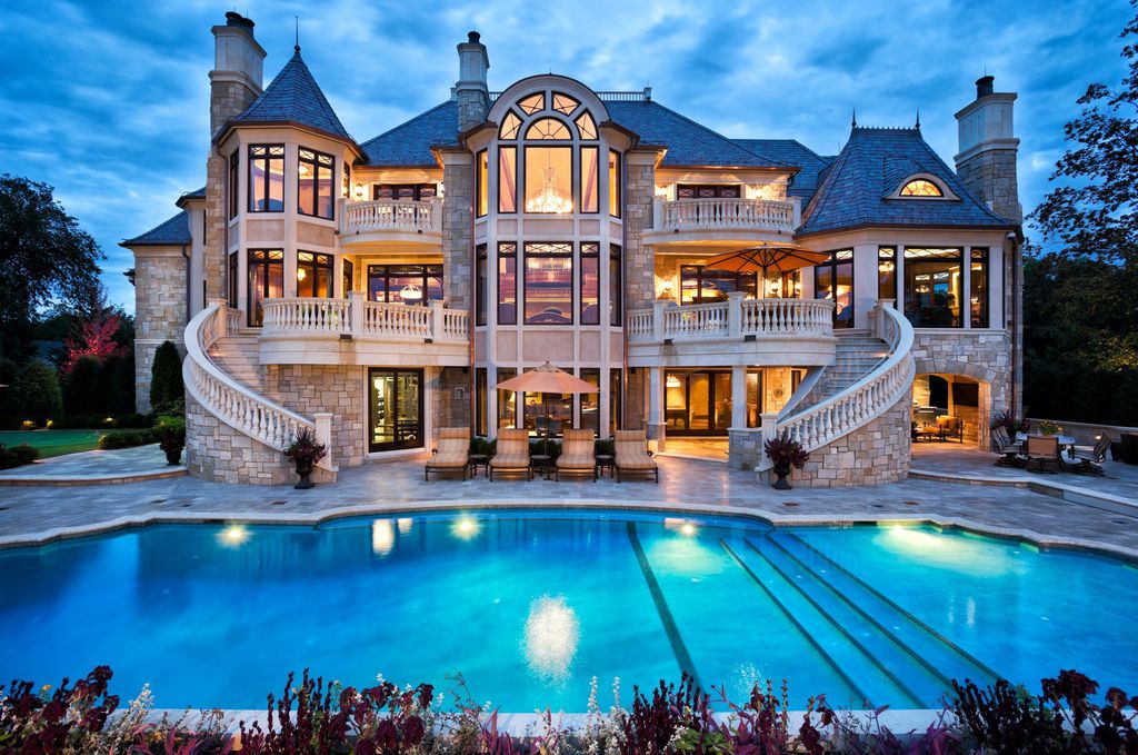 3770 Northome Road Home in Wayzata, Minnesota. Discover the epitome of luxury living on Lake Minnetonka with this John Kraemer & Sons masterpiece. From the luxurious master suite to the state-of-the-art amenities including a bowling alley, golf simulator, and Cavern Music Club, no detail has been overlooked. 