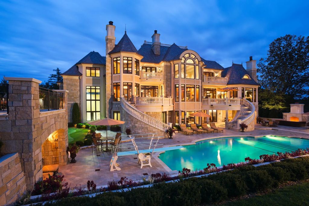 3770 Northome Road Home in Wayzata, Minnesota. Discover the epitome of luxury living on Lake Minnetonka with this John Kraemer & Sons masterpiece. From the luxurious master suite to the state-of-the-art amenities including a bowling alley, golf simulator, and Cavern Music Club, no detail has been overlooked. 